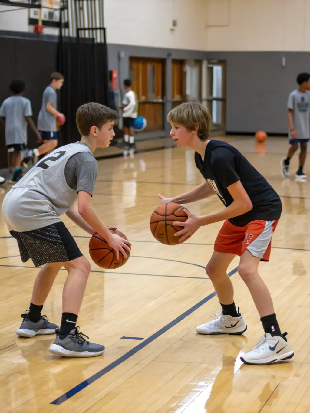 Image of basketball players in UNION SPORTIVE TOUCYCOISE jerseys practicing drills in a gymnasium, emphasizing skill development and athletic training.